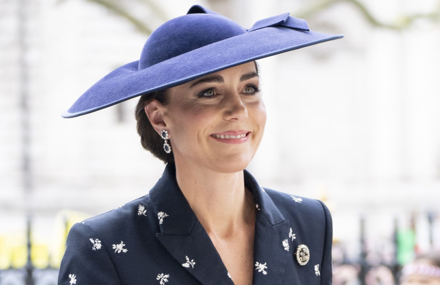 Kate Middleton giving spring vibes in navy erdem peplum jacket and skirt for Commonwealth Day